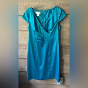 Pretty turquoise dress flattering cut. Stretchy satin.